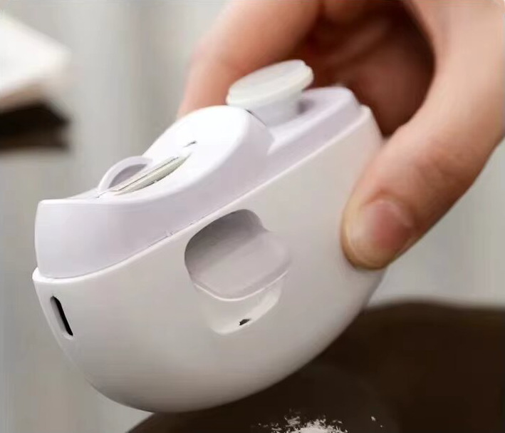 Corta uñas automático